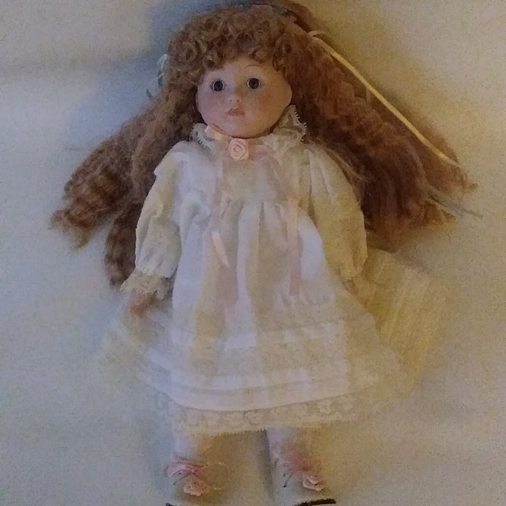 MUSICAL PORCELAIN DOLL